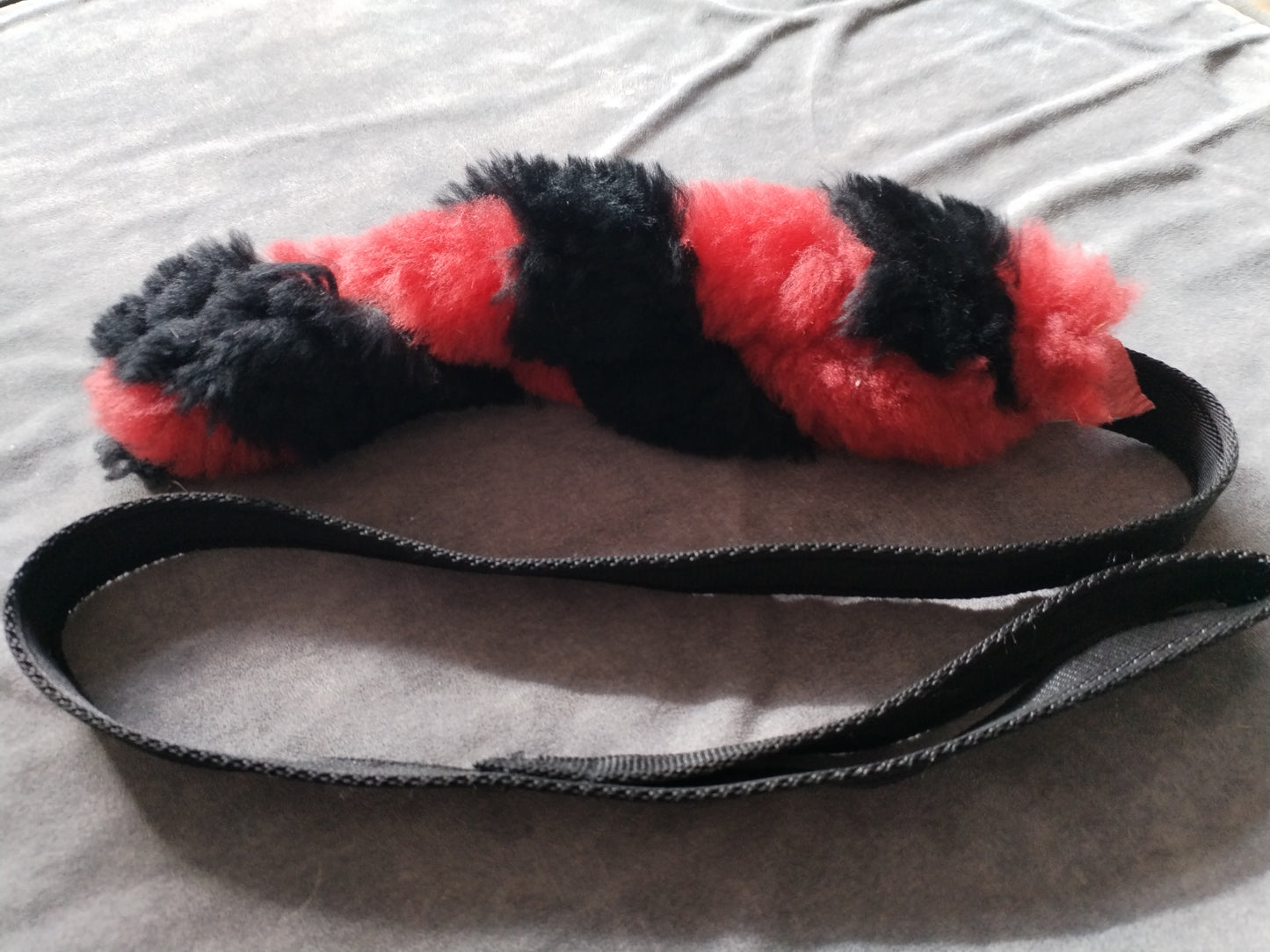 Red and Black Sheepskin Tug Toy.