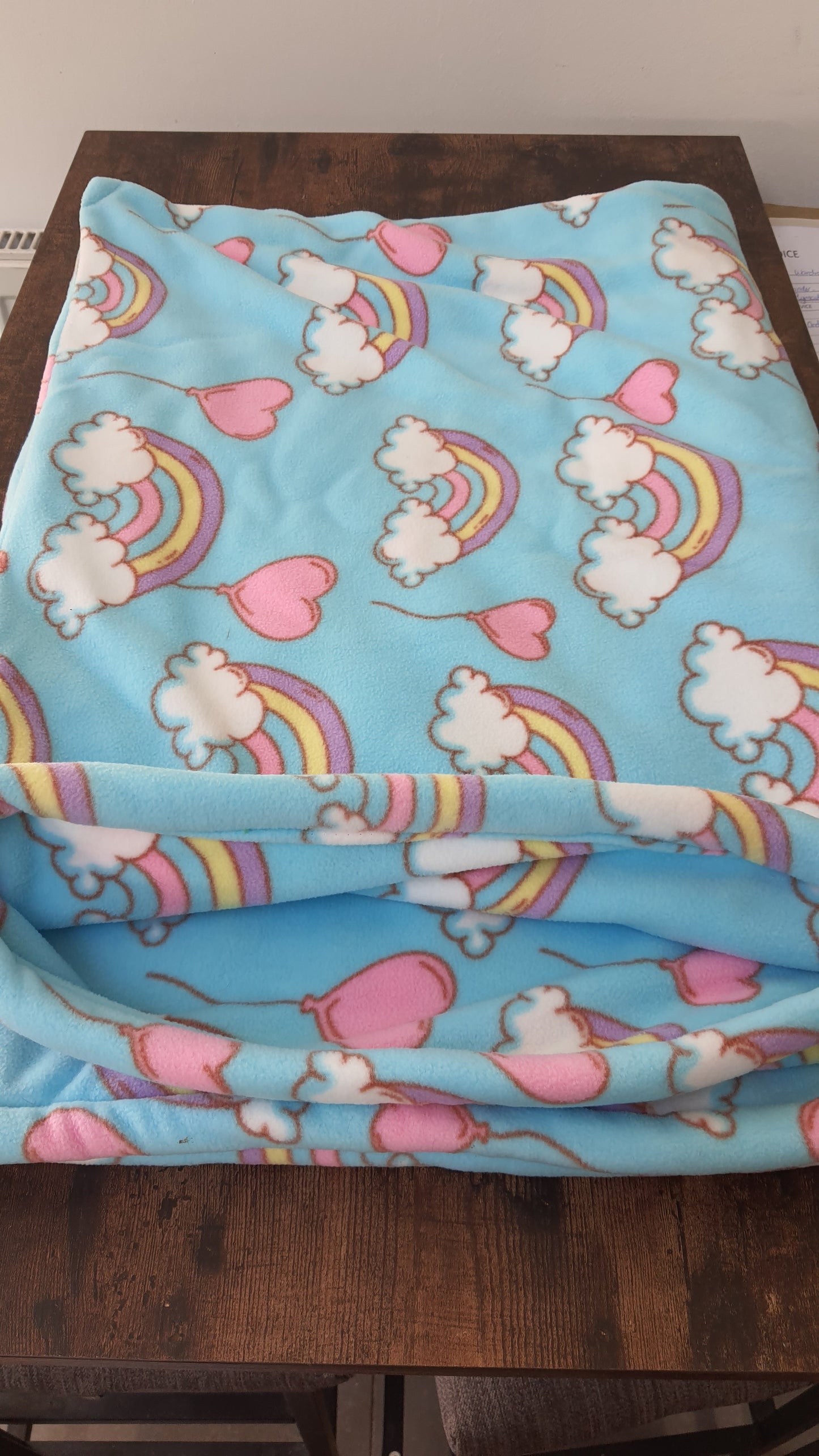 Snuggle Sack light turquoise with rainbows.